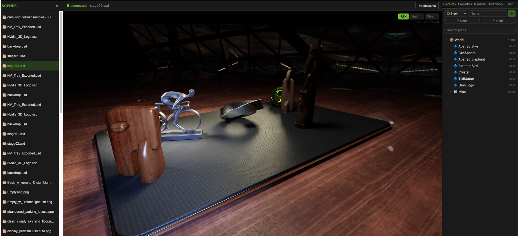 The later browser viewer with the RTX scene, USD hierarchy, primitive creation controls, undo and redo actions, render-mode controls and snapshot action.